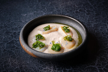 Wall Mural - Bowl with delectable fresh cream soup with sea scallop