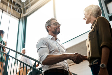 Poster - People, handshake and office with greeting on stairs for business deal and opportunity. Meeting, thank you and welcome with partnership, support and agreement for teamwork, collaboration and smile