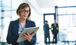 © peopleimages.com - Business woman, connection and tablet for reading email, communication and networking in office. Female financial advisor, internet and fintech for economy news, investment feedback and online search