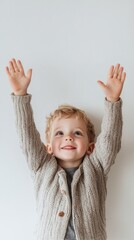 Canvas Print - A little boy with his hands up in the air smiling, AI