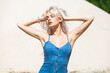 © Andrey_Arkusha - Beautiful blonde girl in blue jeans dress