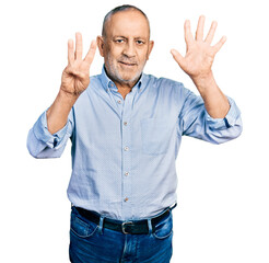 Poster - Senior man with grey hair and beard wearing casual blue shirt showing and pointing up with fingers number eight while smiling confident and happy.