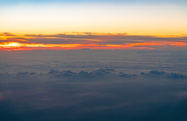 Wall Mural - aerial view of cloud and twilight sky after sunset from airplane
