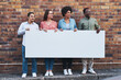 © Frank Coop/peopleimages.com - Advertising, diversity and poster mockup of people outdoor on city street with brick wall background. Business, marketing or space on banner with man and woman employee group together in urban town