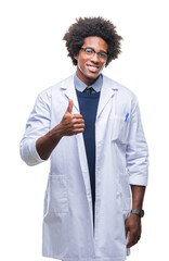 Wall Mural - afro american doctor scientist man over isolated background doing happy thumbs up gesture with hand.