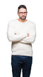 © Krakenimages.com - Young handsome man wearing glasses over isolated background skeptic and nervous, disapproving expression on face with crossed arms. Negative person.