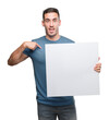 © Krakenimages.com - Handsome young man holding advertising banner with surprise face pointing finger to himself