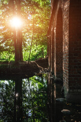 old ancient aqueduct in romantic Arcadia park, antique Roman architecture made of brick wall, historical building, Poland