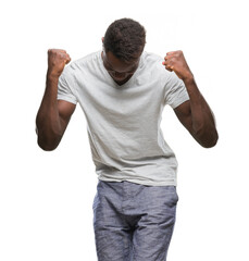 Young african american man over isolated background very happy and excited doing winner gesture with arms raised, smiling and screaming for success. Celebration concept.