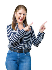 Middle age mature business woman over isolated background smiling and looking at the camera pointing with two hands and fingers to the side.