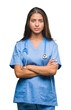 © Krakenimages.com - Young arab doctor surgeon woman over isolated background skeptic and nervous, disapproving expression on face with crossed arms. Negative person.