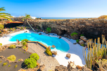 The swimming pool of the César Manrique Volcano House near the Atlantic Coast at Jameos del Agua, in Haria Spain on the Canary Island of Lanzarote.