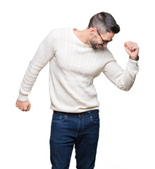 Young handsome man wearing glasses over isolated background Dancing happy and cheerful, smiling moving casual and confident listening to music