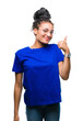 © Krakenimages.com - Young braided hair african american girl wearing glasses over isolated background doing happy thumbs up gesture with hand. Approving expression looking at the camera with showing success.