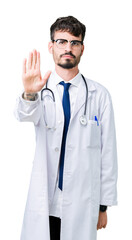 Sticker - Young doctor man wearing hospital coat over isolated background doing stop sing with palm of the hand. Warning expression with negative and serious gesture on the face.