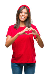 Sticker - Young asian woman over isolated background smiling in love showing heart symbol and shape with hands. Romantic concept.