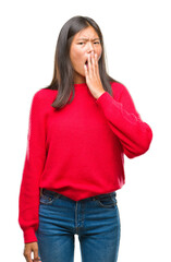 Poster - Young asian woman wearing winter sweater over isolated background bored yawning tired covering mouth with hand. Restless and sleepiness.