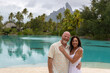 © Mat Hayward - Happy middle aged couple together on Bora Bora island for a tropical vacation together.