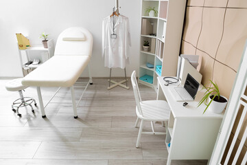 Sticker - Interior of medical office with couch, shelf units and doctor's workplace