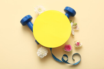 Wall Mural - Composition with blank card, dumbbells, measuring tape and flowers on color background