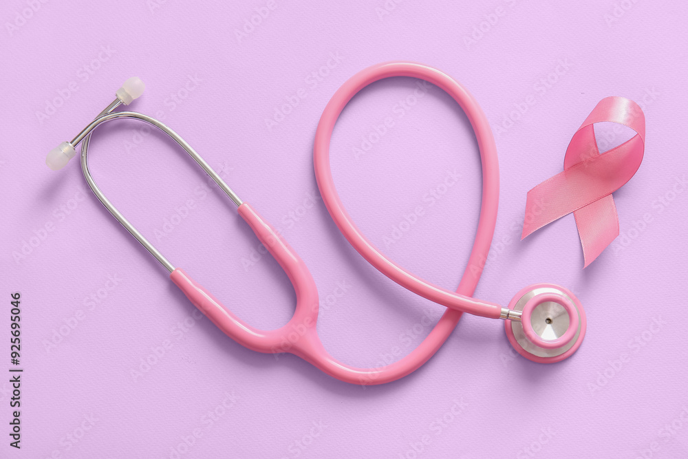 Stethoscope and pink ribbon on lilac background. Breast cancer awareness concept