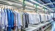© jaeng - Industrial dry cleaning process with clothes hanging on rack, laundry, cleaning, garments, dry-cleaning, industrial