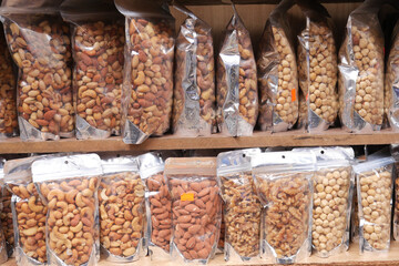 Sticker - many mixed nuts in a plastic packet on shelf 