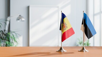 FLAGS OF ANDORRA AND ESTONIA  ON TABLE