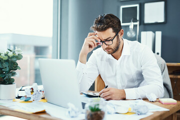 Wall Mural - Business man, laptop and headache with mess, mistake and thinking for problem solving at insurance agency. Person, computer and stress at office, crisis and documents with error for stats at company