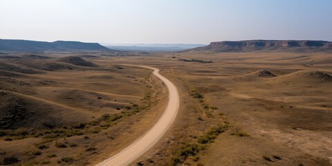 A road winds its way through a wilderness landscape setting. With copy space.