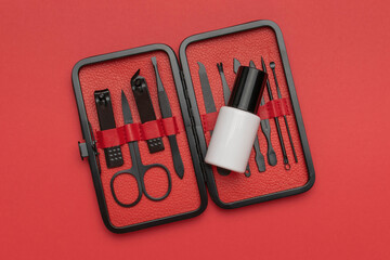 Professional Manicure Set with Nail Polish on Red Background - Grooming, Hygiene, and Beauty