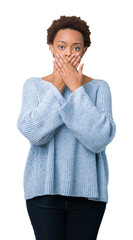 Sticker - Young beautiful african american woman wearing a sweater over isolated background shocked covering mouth with hands for mistake. Secret concept.