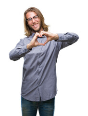 Sticker - Young handsome man with long hair wearing bow tie over isolated background smiling in love showing heart symbol and shape with hands. Romantic concept.