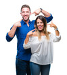 © Krakenimages.com - Young couple in love over isolated background smiling confident showing and pointing with fingers teeth and mouth. Health concept.