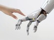 © Vitalii Shkurko - A human hand reaches out to touch a robotic hand, symbolizing the interaction and connection between humans and advanced technology
