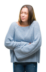 Sticker - Young beautiful caucasian woman wearing winter sweater over isolated background with hand on stomach because nausea, painful disease feeling unwell. Ache concept.