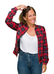 Wall Mural - Middle age adult woman wearing casual jacket over isolated background confuse and wonder about question. Uncertain with doubt, thinking with hand on head. Pensive concept.