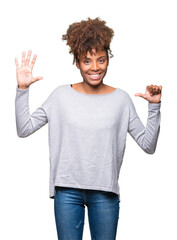 Wall Mural - Beautiful young african american woman over isolated background showing and pointing up with fingers number six while smiling confident and happy.