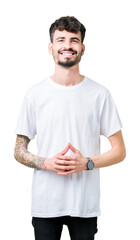 Canvas Print - Young handsome man wearing white t-shirt over isolated background Hands together and fingers crossed smiling relaxed and cheerful. Success and optimistic