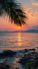 Wall Mural - A beautiful sunset over the ocean with a palm tree in the foreground