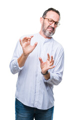 Sticker - Middle age hoary senior man wearing glasses over isolated background disgusted expression, displeased and fearful doing disgust face because aversion reaction. With hands raised. Annoying concept.