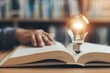 © Nld - The light bulb over the book represents creativity and innovation in education
