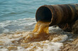 © john - a water pipe spilling brown dirty waste water into the sea