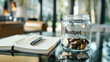 © Luluraschi - a jar filled with coins and small bills, savings, budget plan, middle class economy