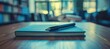 © Eyepain - notebook on wood table with pen blur background library