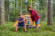 © vetal1983 - A family is relaxing at a campsite in the forest. Mother and son drink coffee near the tent.