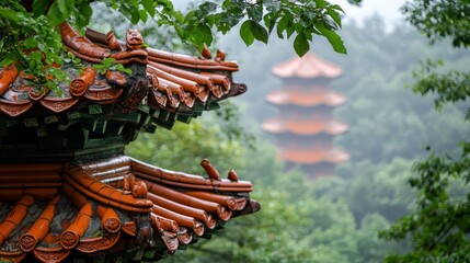  A building with a red-tiled roof stands before trees, while a pagoda looms in the background