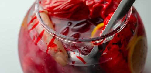 Poster - A Halloween bowl with punch, with imitation body parts dipped in red cocktail