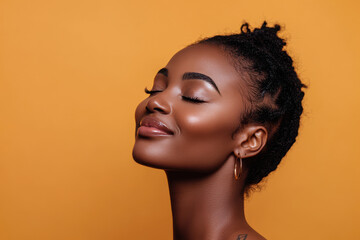 A close up of a tattooed black woman's face with her eyes closed