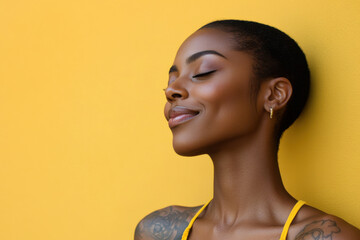 A close up of a tattooed black woman's face with her eyes closed